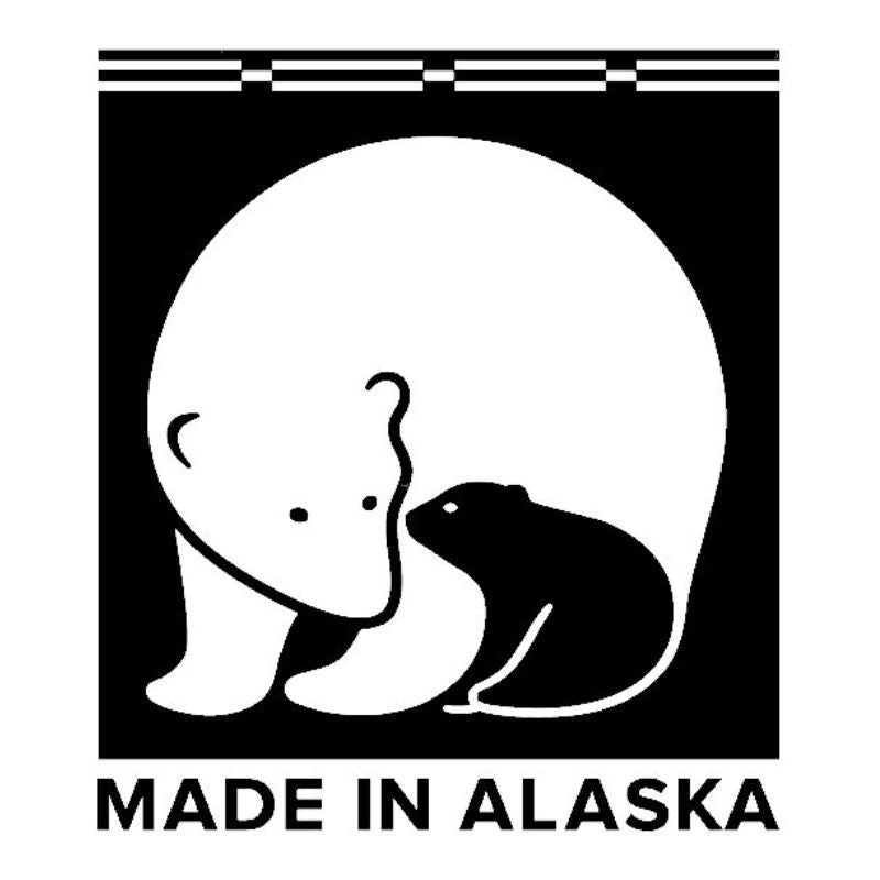 Made in Alaska Logo. The graphics is black and white of a stylized drawing of a mother polar bear and her cub.
